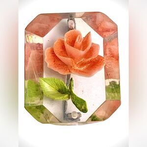 Vintage coral colored rose reverse carved lucite pin